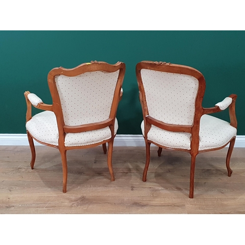 40 - Two cream upholstered French Style Elbow Chairs.