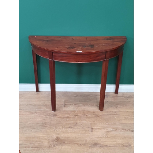 453 - A 19th Century mahogany Demi-Lune Side Table on square tapered supports, 2ft 4