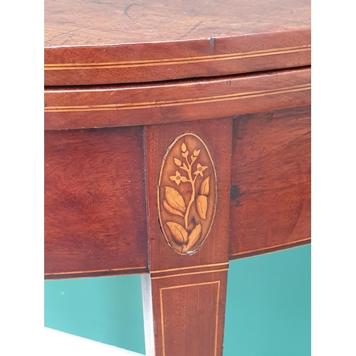 454 - A 19th Century mahogany demi - lune Fold Over Tea Table with satinwood inlaid decoration on tapered ... 