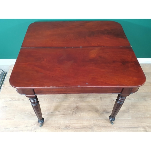 460 - A 19th Century mahogany Fold over Tea Table on turned and fluted tapered supports and castors, 2ft 6... 