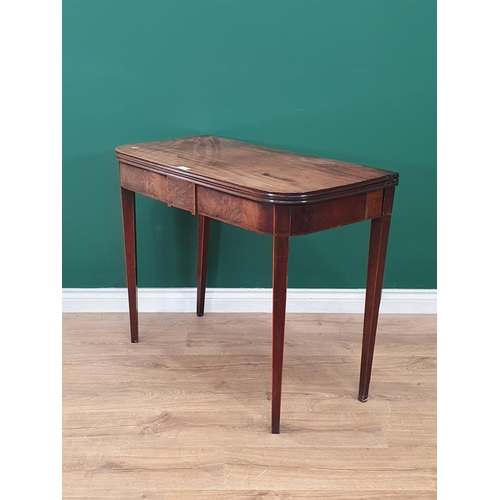 475 - A 19th Century mahogany Fold over Tea Table with satinwood stringing, on square tapered supports, A/... 