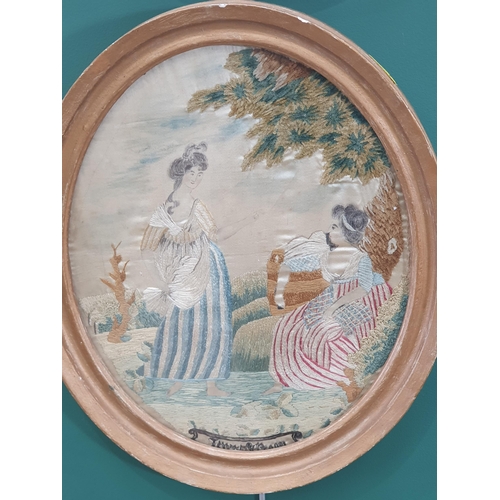 489 - A pair of gilt framed oval tapestry and silk work Panels of figures in landscapes.