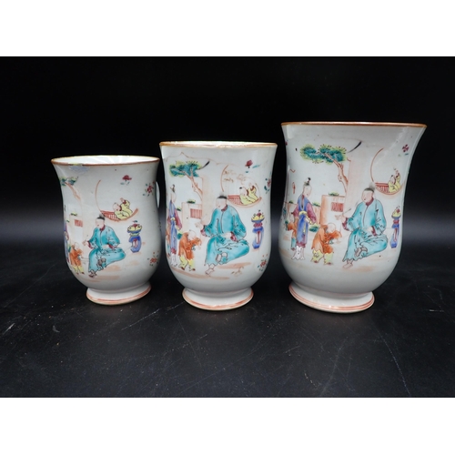 91 - A Set of three Chinese polychrome graduated bell shape Mugs painted figures and flowers in bright en... 