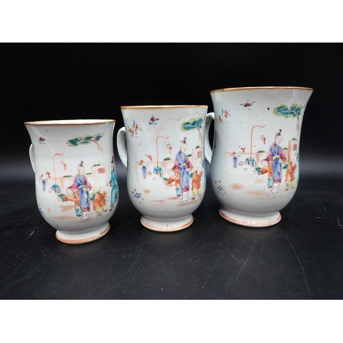 91 - A Set of three Chinese polychrome graduated bell shape Mugs painted figures and flowers in bright en... 