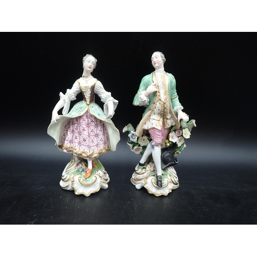 94 - A pair of Derby Figures brightly painted and floral encrusted, 7½in, a pair of Meisson Figures in ro... 