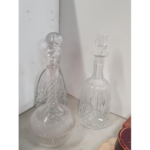 306 - Five various glass decanters and stoppers a Sitzendorf Figure of a lady and another with a label for... 