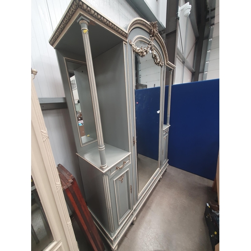 515 - A French blue and cream painted mirror door Armoire with egg and dart cornice and floral swag decora... 