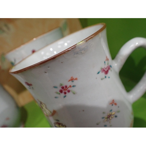 91 - A Set of three Chinese polychrome graduated bell shape Mugs painted figures and flowers in bright en... 