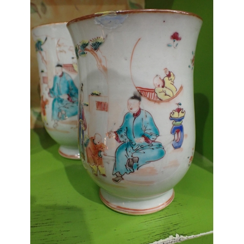 91 - A Set of three Chinese polychrome graduated bell shape Mugs painted figures and flowers in bright en... 