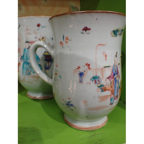 91 - A Set of three Chinese polychrome graduated bell shape Mugs painted figures and flowers in bright en... 