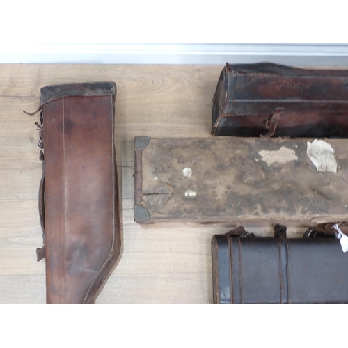 1109 - A hard Sporting Rifle Case bearing John Rigby and Co. label, a leather Gun Case and four Leg of Mutt... 