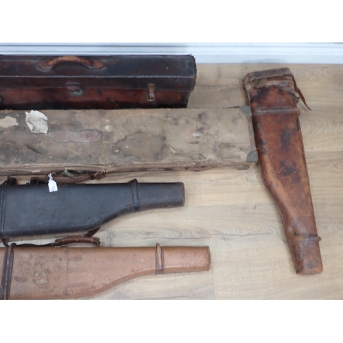 1109 - A hard Sporting Rifle Case bearing John Rigby and Co. label, a leather Gun Case and four Leg of Mutt... 