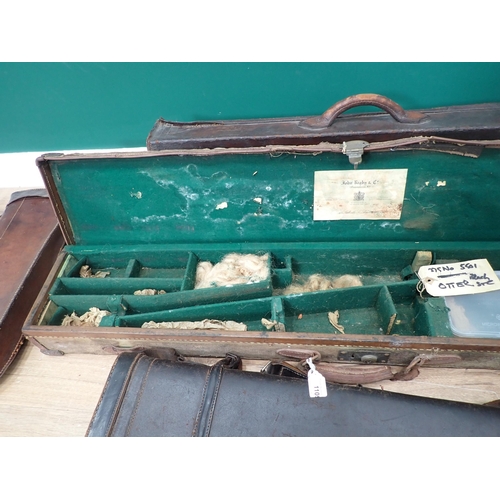 1109 - A hard Sporting Rifle Case bearing John Rigby and Co. label, a leather Gun Case and four Leg of Mutt... 