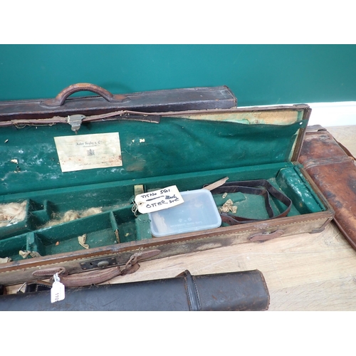 1109 - A hard Sporting Rifle Case bearing John Rigby and Co. label, a leather Gun Case and four Leg of Mutt... 