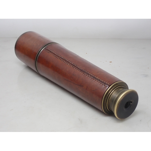 1111 - A WWI period leather covered Telescope by Broadhurst Clarkson & Co in fitted leather case and a pair... 