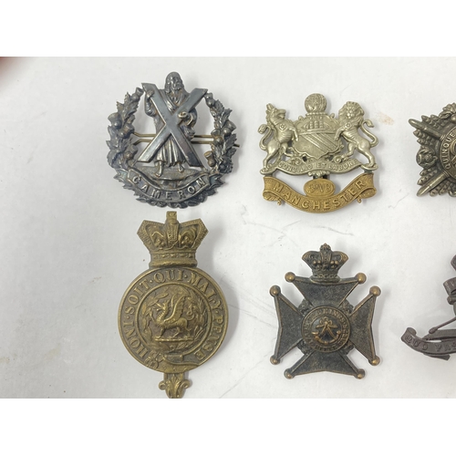 1115 - Ten British Army Cap Badges including The Suffolk Regiment, The London Rifle Brigade, Cameron Highla... 