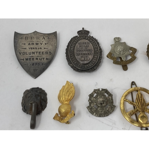 1116 - A box of Military and Police Cap Badges, Buttons and other Badges including 1899 Queen's Prize Posit... 