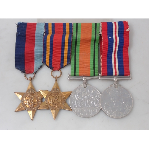 1153 - Four; WWII 1939-45 Star, Burma Star, Defence and War Medals, unnamed as issued but direct from famil... 