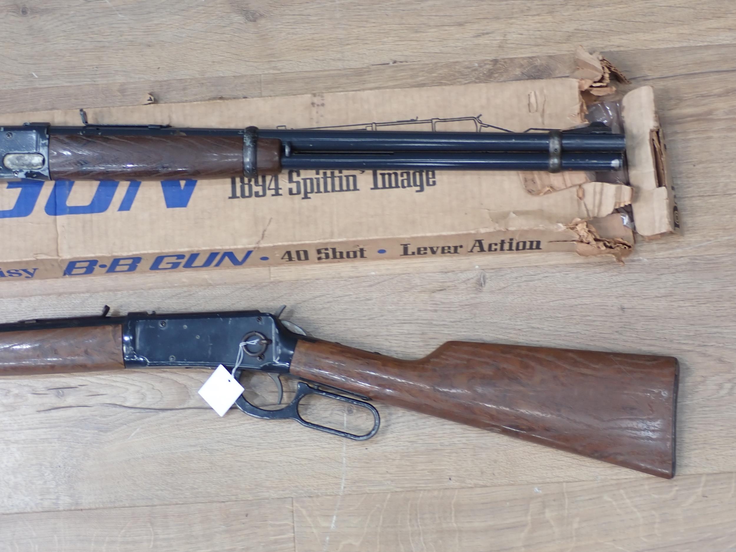 A Boxed Daisy 1894 Spittin' Image BB Gun, And Another Unboxed