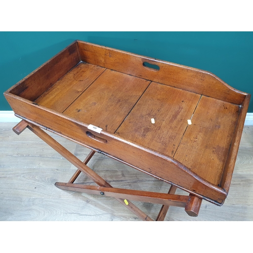 552 - A 19th Century mahogany Butlers Tray on folding stand.