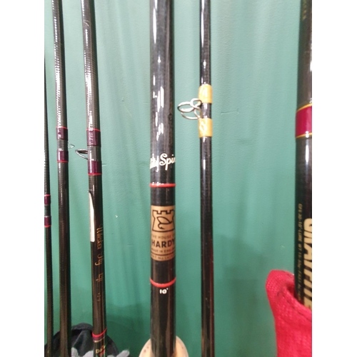 1012 - A Hardy Fibalite two piece Spinning Rod 305cm (10ft), a Berkley Carbon two piece Rod, a Daiwa Whiske... 