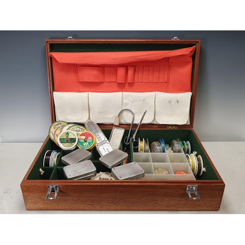 1016 - A teak fitted Reel & Tackle Case with baize lined compartments containing assorted Lines, x4 Wheatle... 