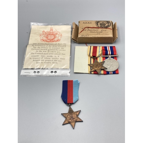 1058 - Three; WWII trio including War Medal, 1939-45 Star and Africa Star, with box of issue and condolence... 