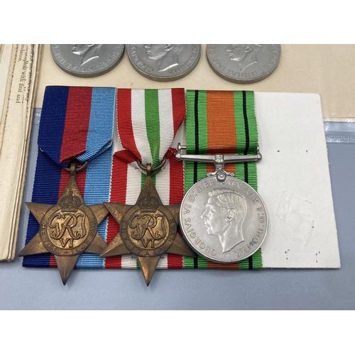 1059 - Four; WWII trio including Defence Medal, War Medal, 1939-45 Star and Italy Star in box of issue with... 