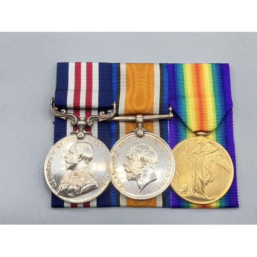 1219 - Three; Military Medal George V, British War & Victory Medals to S.22758 Pte. Theodore D. Emslie, 2nd... 