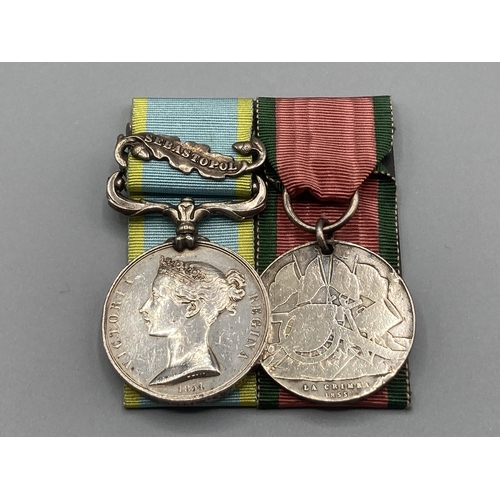 1215 - Two; Crimea Medal with Sebastopol clasp and Turkish Crimea Medal to 3265 Thomas Griffin, 93rd Suther... 