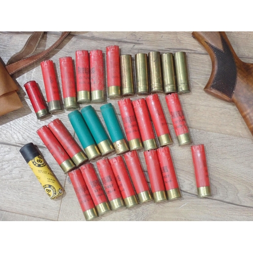 1050 - Box of Shooting equipment into approximately 100 10 bore empty Cartridge Cases, pigskin Cartridge Ba... 