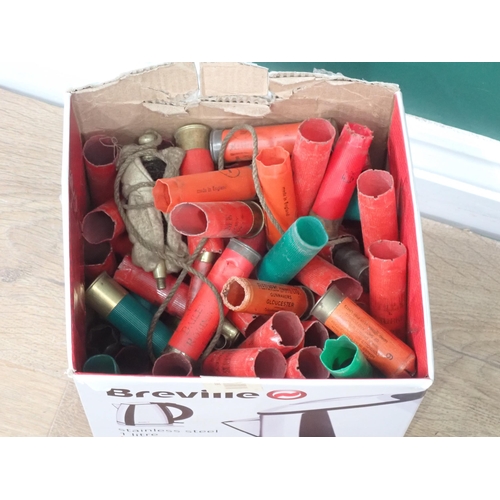 1050 - Box of Shooting equipment into approximately 100 10 bore empty Cartridge Cases, pigskin Cartridge Ba... 