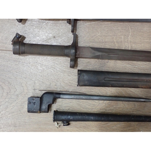 1103 - A Lee Enfield Spike Bayonet, a US Bayonet and another Bayonet