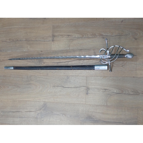 1170 - A replica of a Rapier with open guard and waved blade in leather scabbard 3ft 3in overall