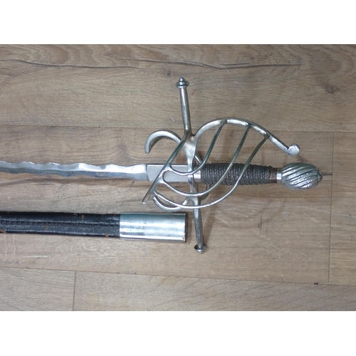 1170 - A replica of a Rapier with open guard and waved blade in leather scabbard 3ft 3in overall