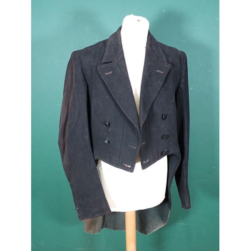 1190 - A black 'swallowtail' Hunting Coat by Huntsman of Saville Row with tattersall lining