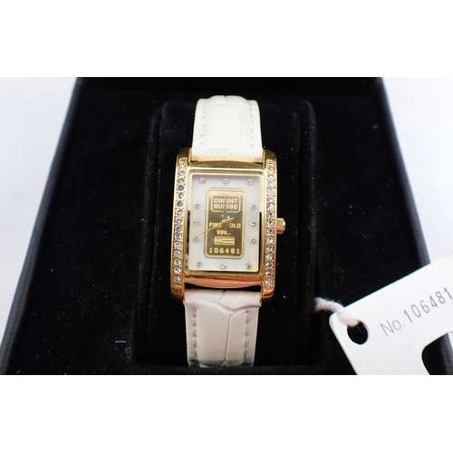 104 - A lady's Credit Suisse quartz Wristwatch the white rectangular dial with hourly crystal dot markers ... 