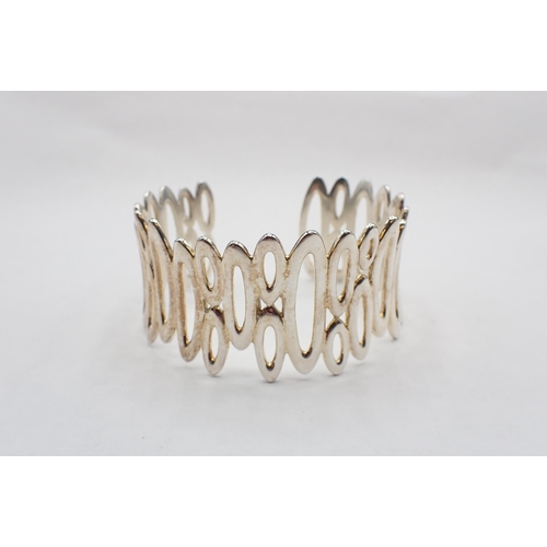 122 - A contemporary silver rigid pierced Cuff/Bangle, stamped 925