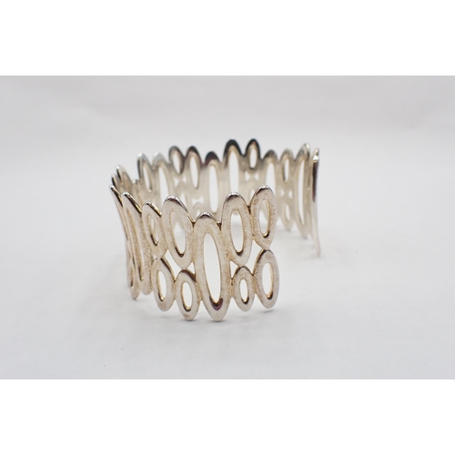 122 - A contemporary silver rigid pierced Cuff/Bangle, stamped 925