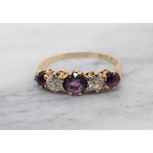 127 - An Amethyst and Diamond five stone Ring claw-set three round amethysts with two old-cut diamonds bet... 