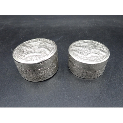 13 - Two Cambodian silver circular Boxes embossed dragons, etc, approx, 2½in