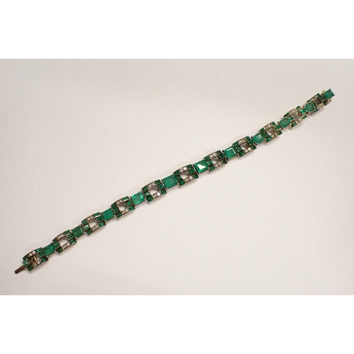 136 - An Art Deco Emerald and Diamond articulated line Bracelet comprised of eleven rectangular links each... 