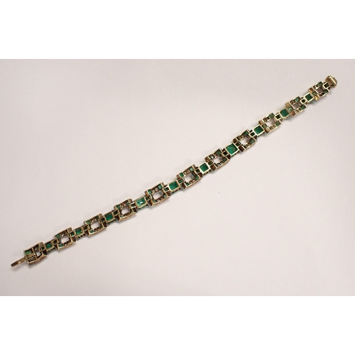 136 - An Art Deco Emerald and Diamond articulated line Bracelet comprised of eleven rectangular links each... 