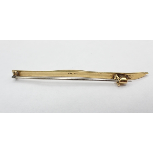 138 - A 1930's Brooch formed as a Ski engraved 'The Wengen. Golden Sky 1931', stamped 18K, approx 4.90gms,... 