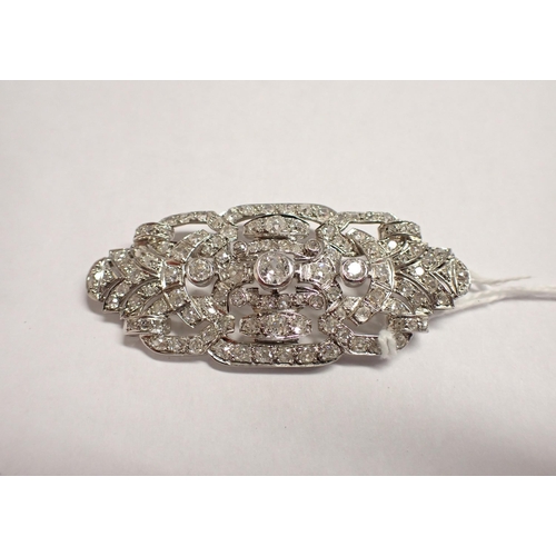 144 - An Art Deco Diamond Brooch the openwork elliptical plaque pavé-set throughout old-cut stones, unmark... 