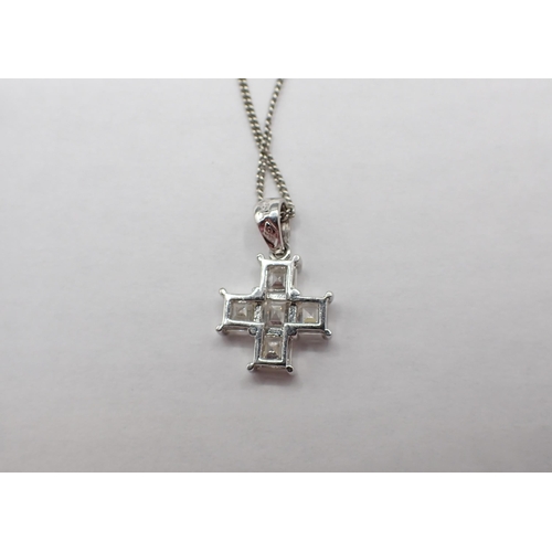 145 - A contemporary Diamond Cross corner claw-set five Asscher-cut stones in white gold stamped 750, on f... 