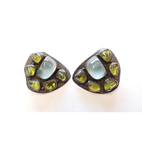 146 - A pair of H Fred Skaggs sterling silver Ear Clips each set foil backed blue and green stones