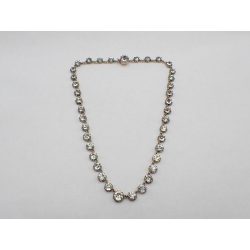 147 - A Georgian Riviere Necklace close-set graduated round paste in silver backed with gold, 35.5cms long