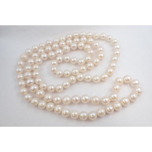 148 - An opera length string of large freshwater Cultured Pearls