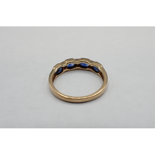 150 - A Sapphire and Diamond seven stone Ring invisibly-set four oval-cut sapphires interspersed with thee... 